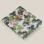 Book with green leaf pattern and red text on a beige background