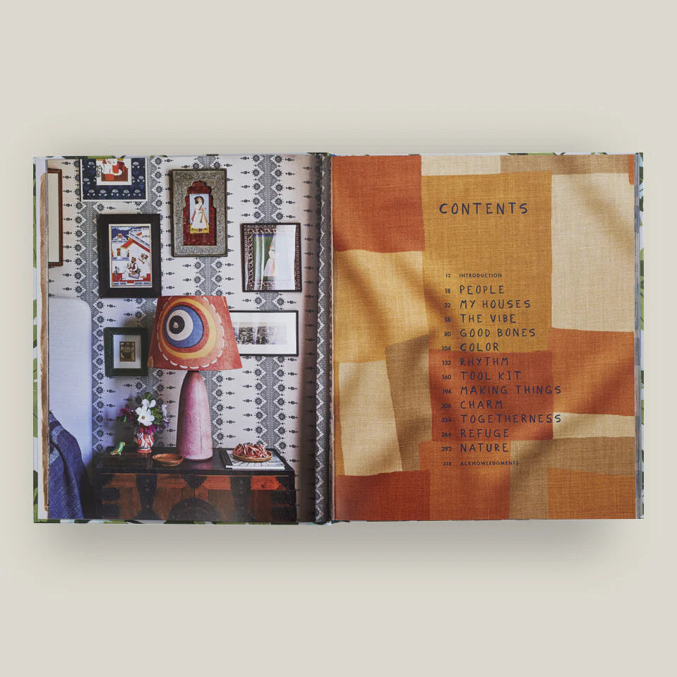 Open book with interior design-themed pages on a white background