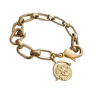 tevie Bracelet features a gold chainlink design with a hidden push clasp for a seamless, permanent jewelry look. A gold coin charm engraved with a bee adds meaning and charm.