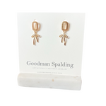olished gold square stud with a delicate bow design that drops