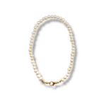 Pearl necklace with a gold clasp on a white background