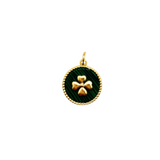 Round charm with green malachite-style background and gold-tone four-leaf clover, framed by a twisted gold border.
