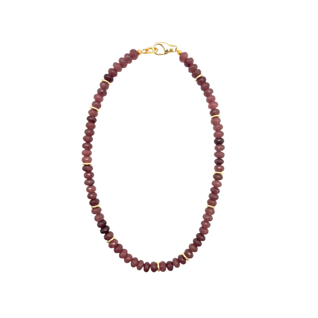 Necklace with red beads on a white background