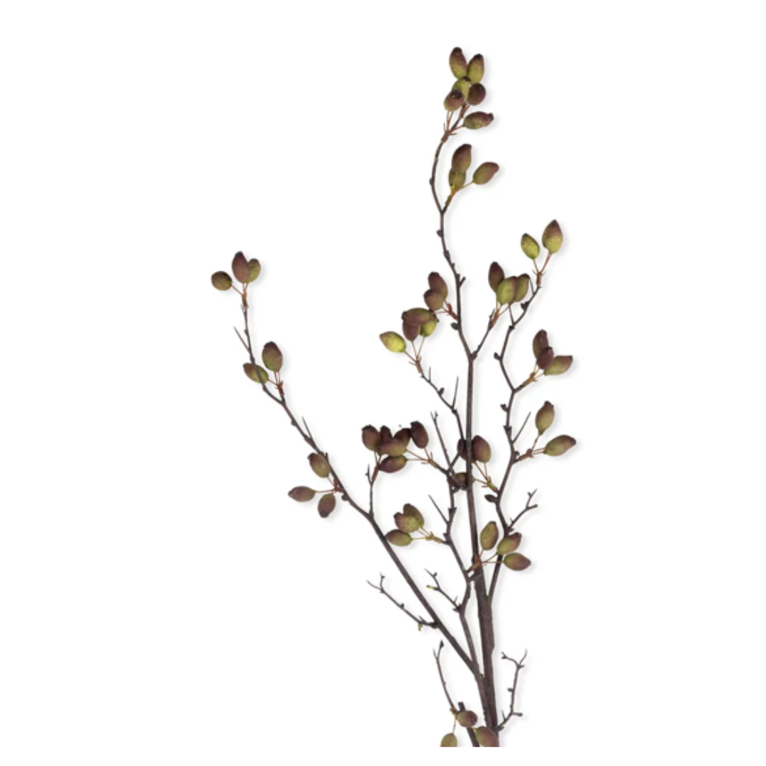 Artificial plant branch with green leaves on a white background