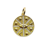 gold evil eye charm on white background