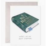 Book-shaped card with 'A Big Beautiful Life' text and 'Here's to the Next Chapter!' message.