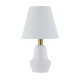 Table lamp with a white shade and gold accent on a white background