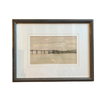 Framed artwork of a pier on a white background