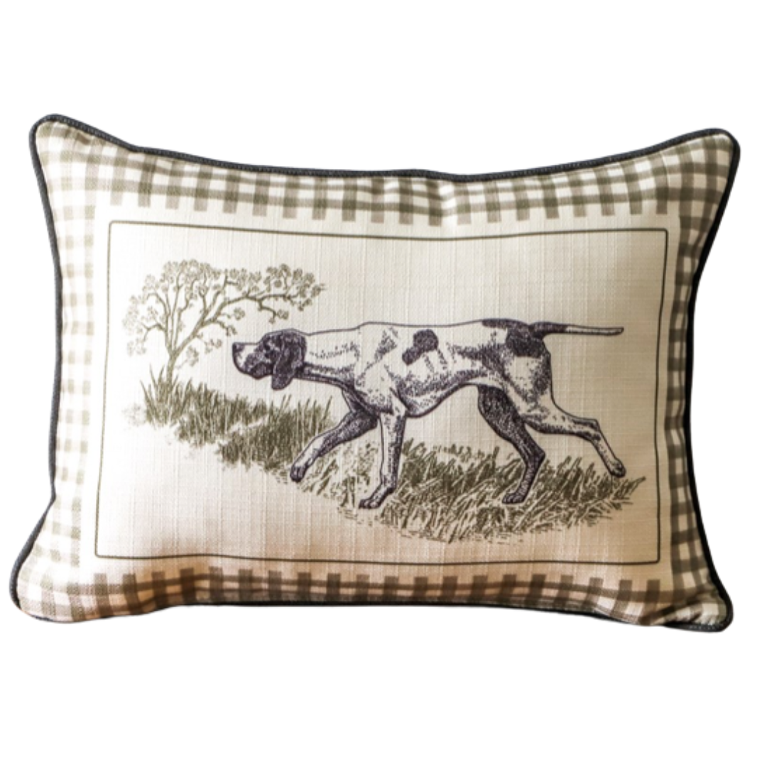 Decorative pillow with a checkered border featuring an illustration of a dog in a natural setting.