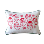 Decorative pillow with red Santa Claus illustrations and snowflakes on a white background