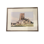 Framed artwork of a church with a white border