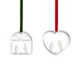 Two silver Christmas ornaments with cut-out figures on a white background