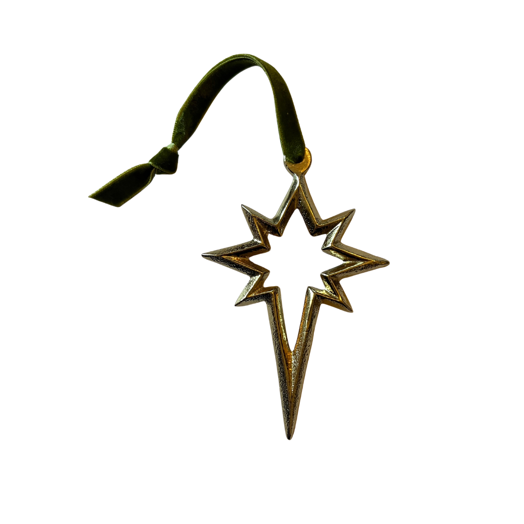 Decorative star-shaped ornament with a green ribbon on a white background