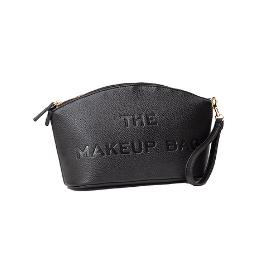 Black makeup bag with 'THE MAKEUP BAG' text on a white background