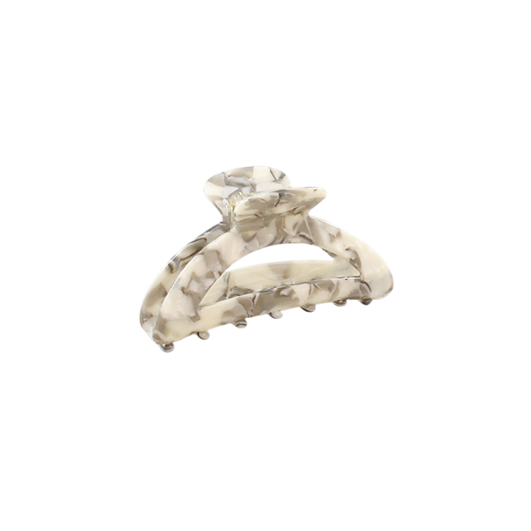 Marble-patterned hair clip on a white background