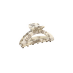 Marble-patterned hair clip on a white background