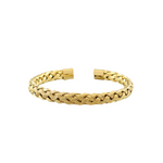 Gold braided bracelet on a white background