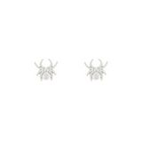 Pair of silver spider earrings on a white background