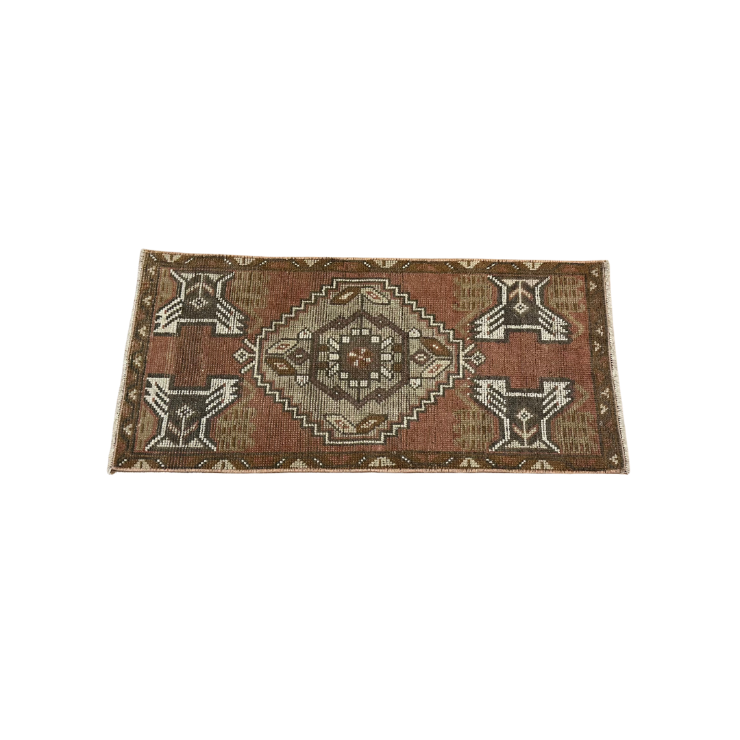 Rectangular rug with geometric pattern on a white background