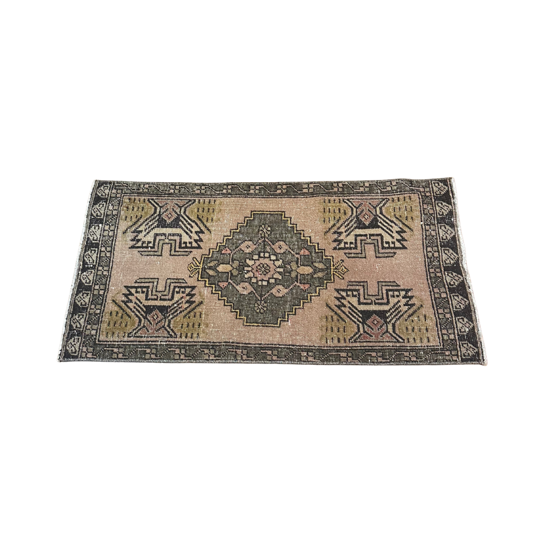 Decorative rug with geometric pattern on a white background