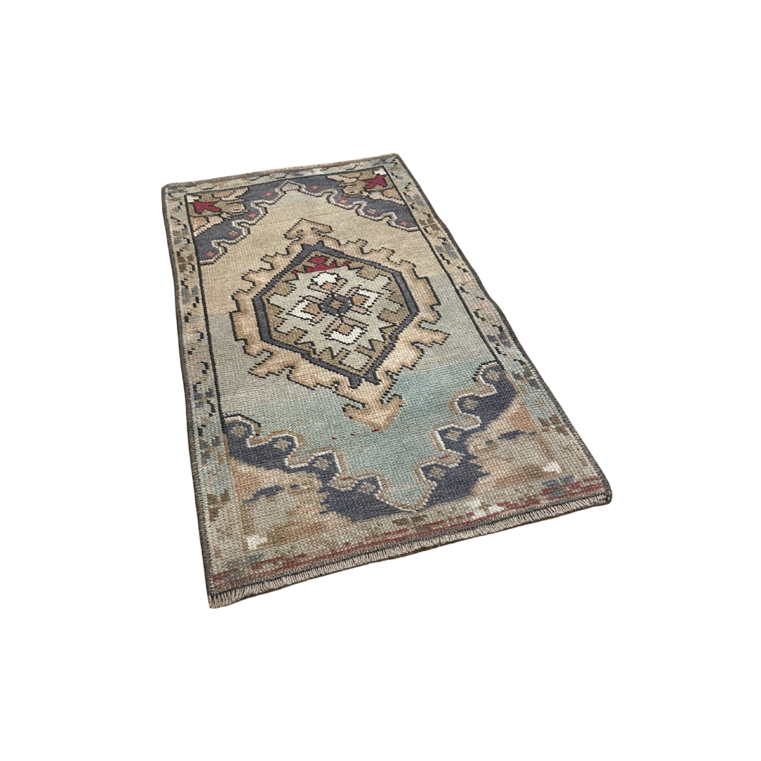 Decorative rug with geometric pattern on a white background