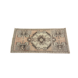 Small rug with geometric pattern on a white background