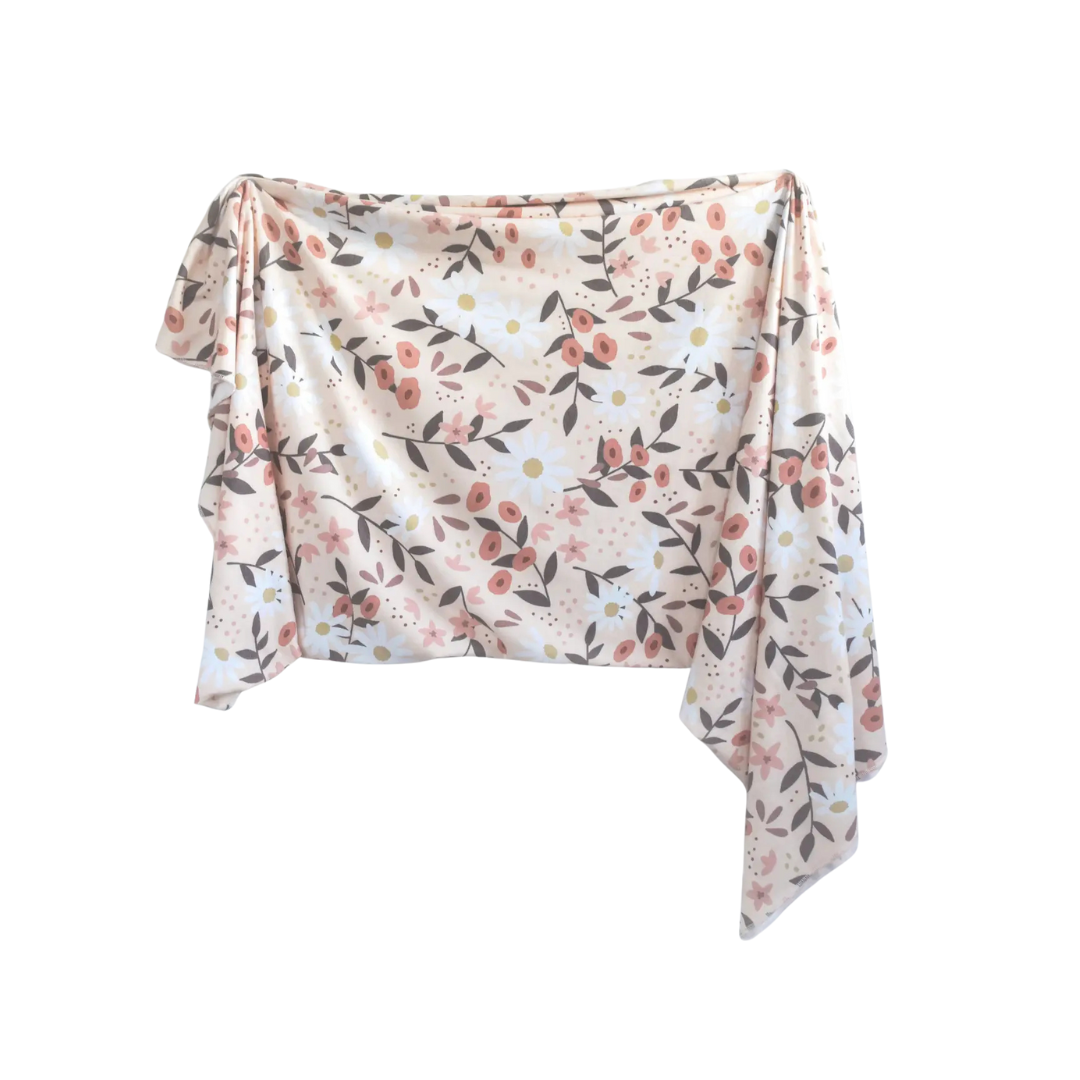Floral patterned swaddle blanket on a white background
