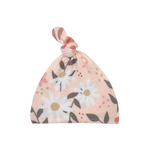 Floral patterned baby hat on a white background