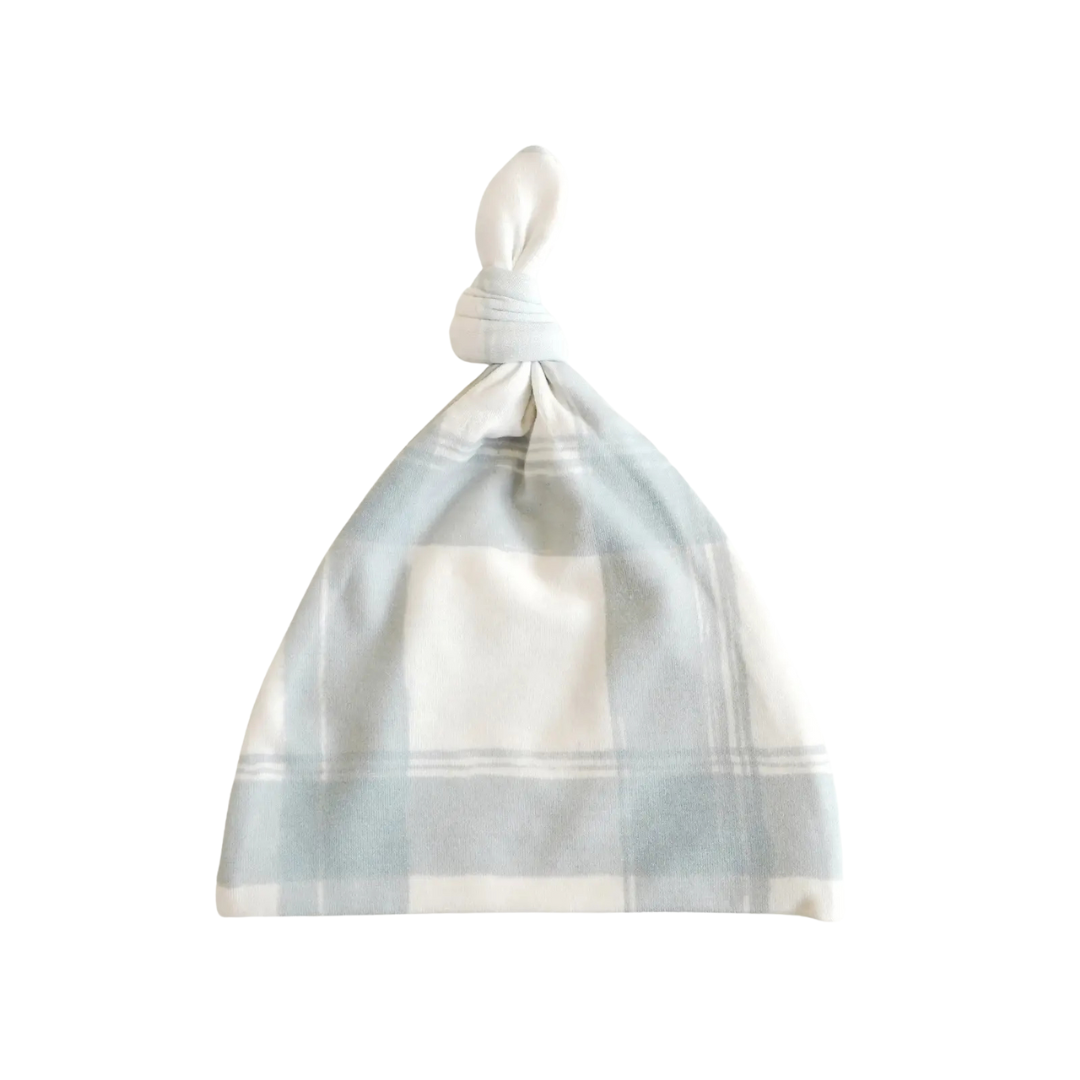 Plaid patterned baby hat on a white background