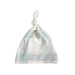 Plaid patterned baby hat on a white background