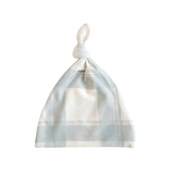 Plaid patterned baby hat on a white background