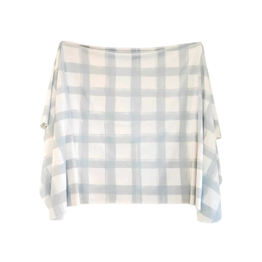 Plaid blanket with light blue and white pattern on a white background