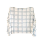 Plaid blanket with light blue and white pattern on a white background
