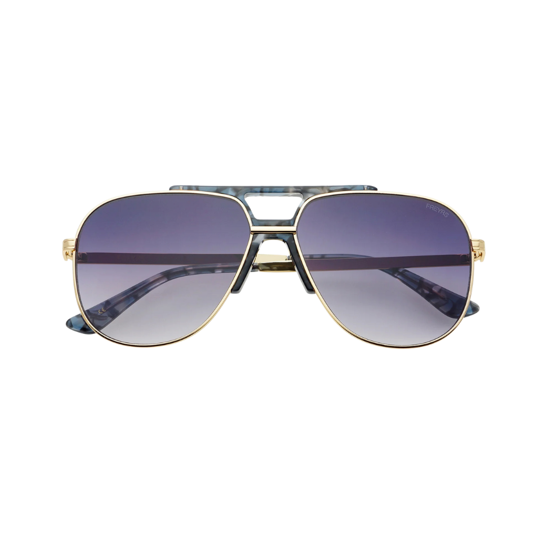 Sunglasses with gold frame and purple lenses on a white background
