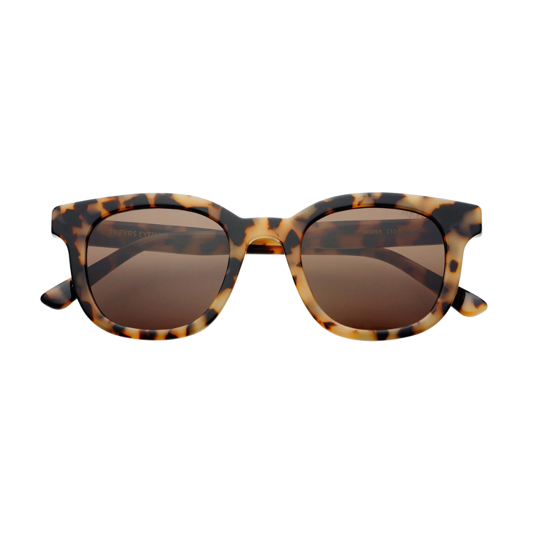 Tortoiseshell sunglasses with brown lenses on a white background