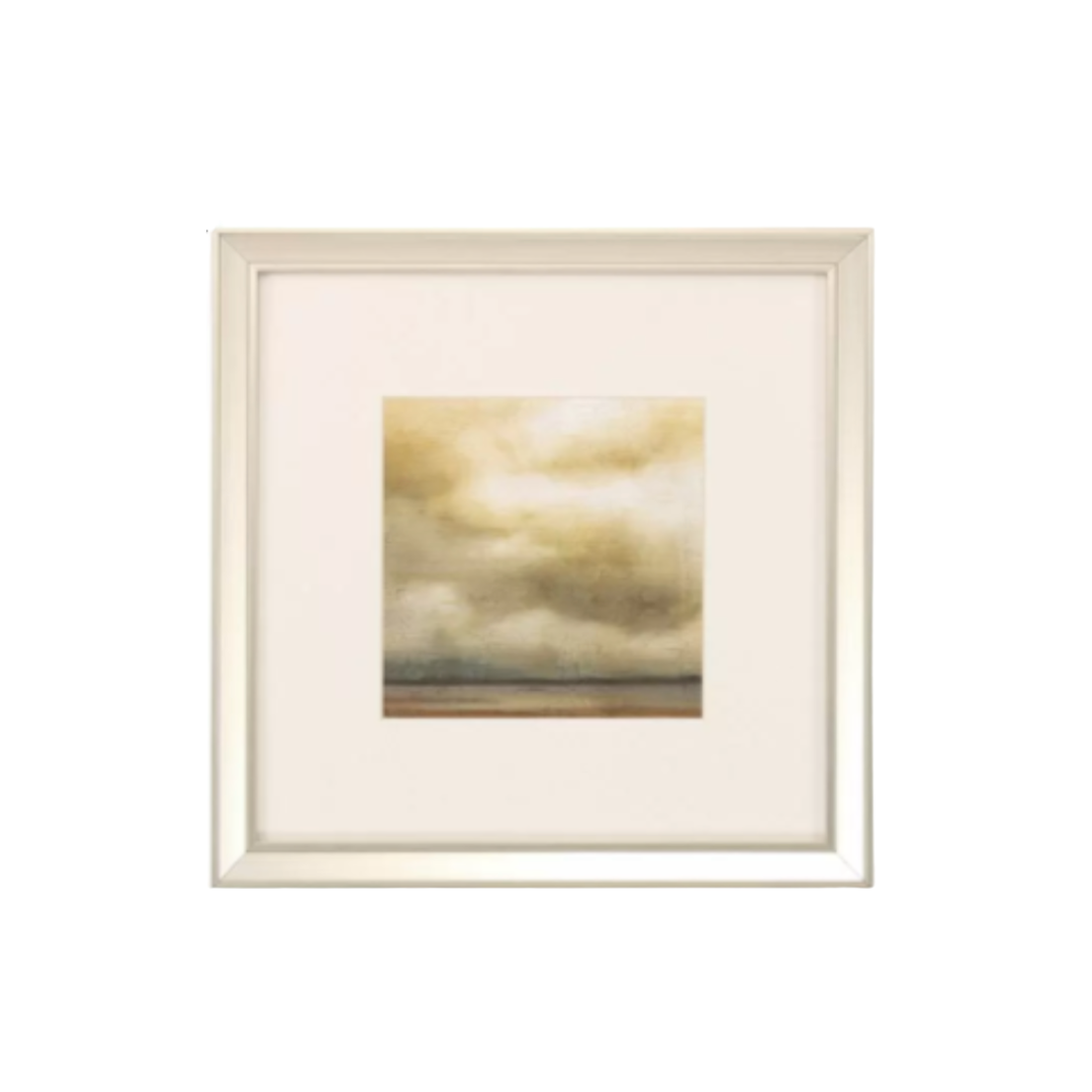 Framed artwork with a landscape of clouds and water on a white background