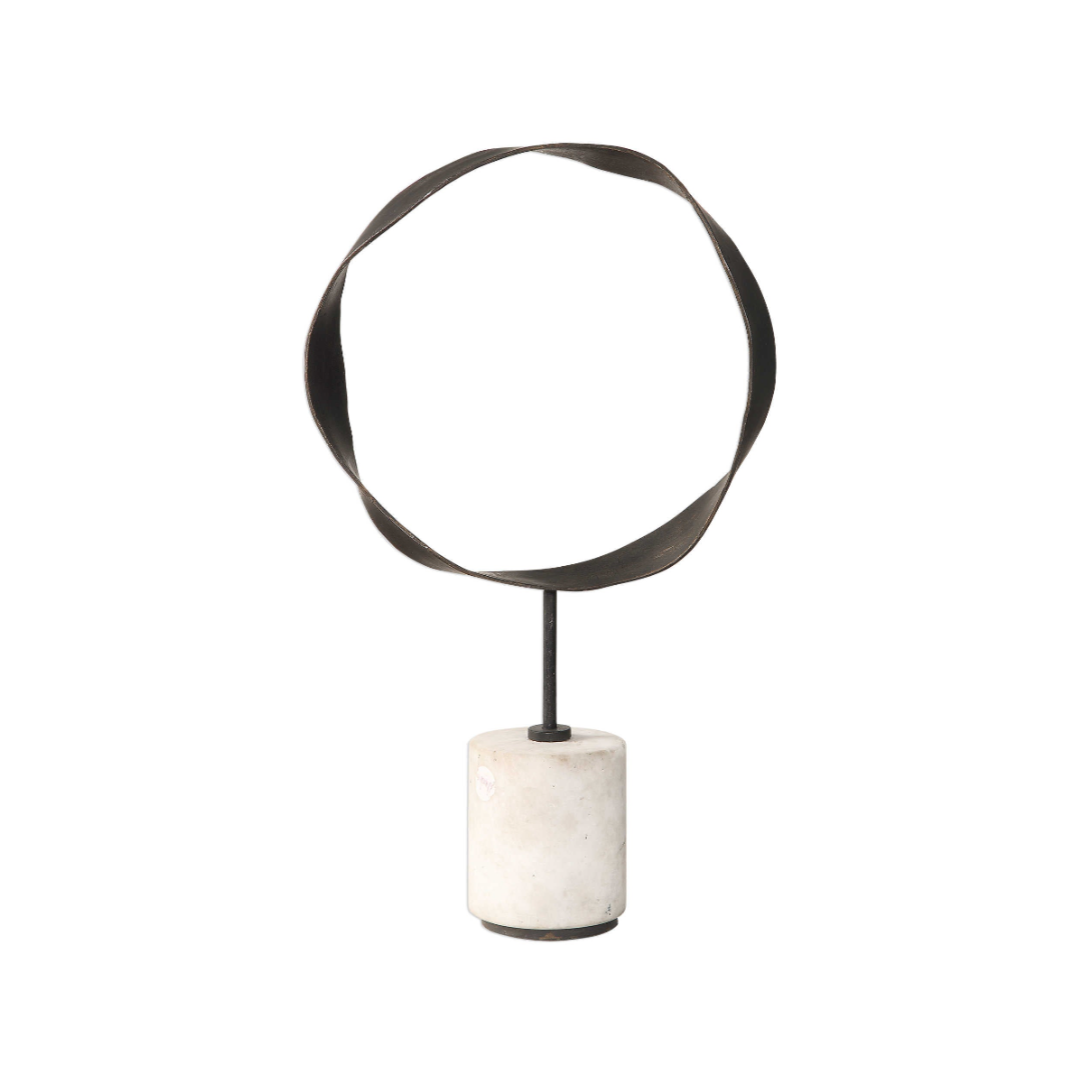 Decorative object with circular metal top and marble base on a white background