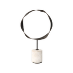 Decorative object with circular metal top and marble base on a white background
