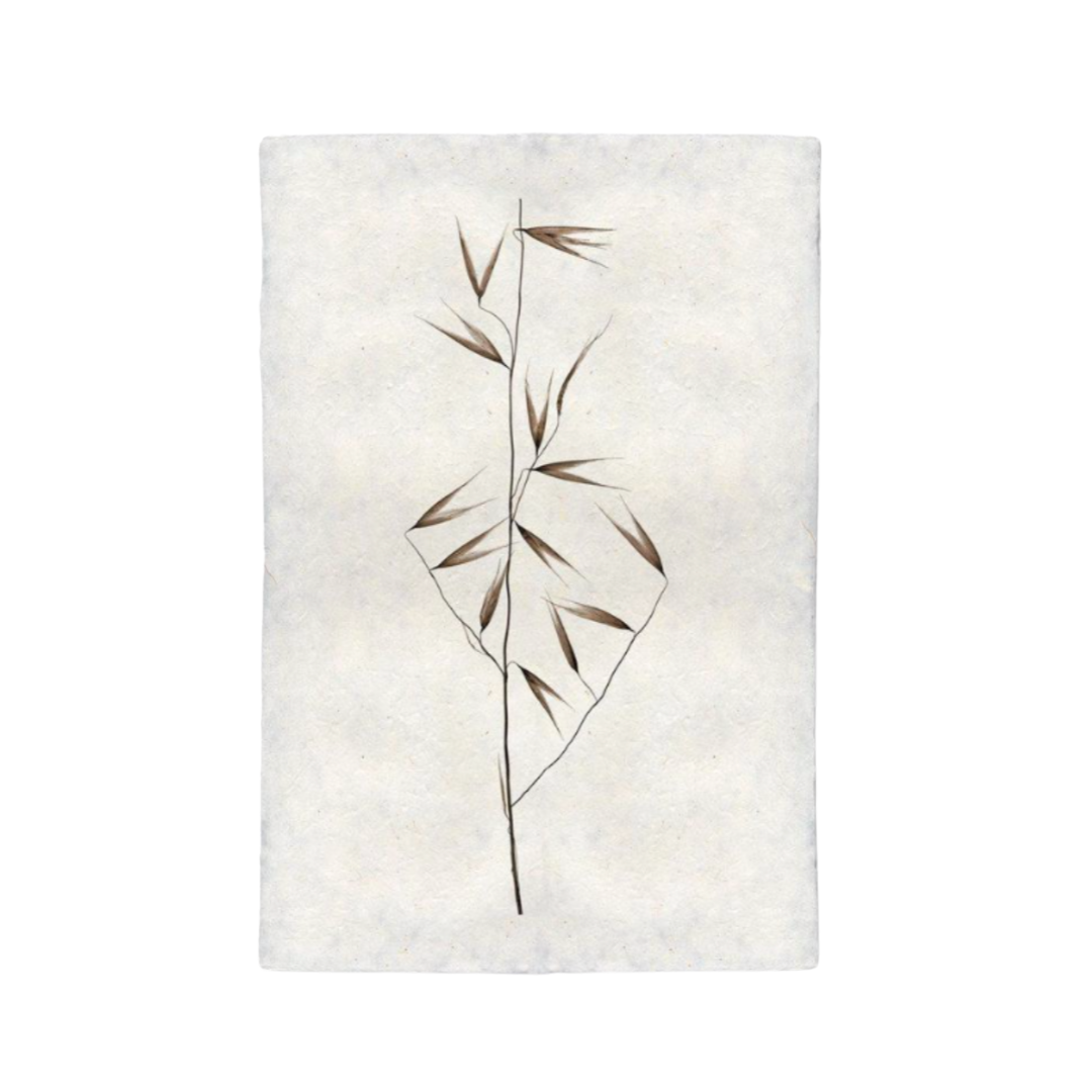 Textured white rug with a leaf design on a plain background