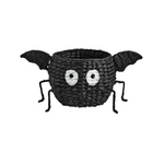Black spider-shaped basket with eyes and legs on a white background