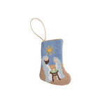Decorative ornament with nativity scene on a blue background