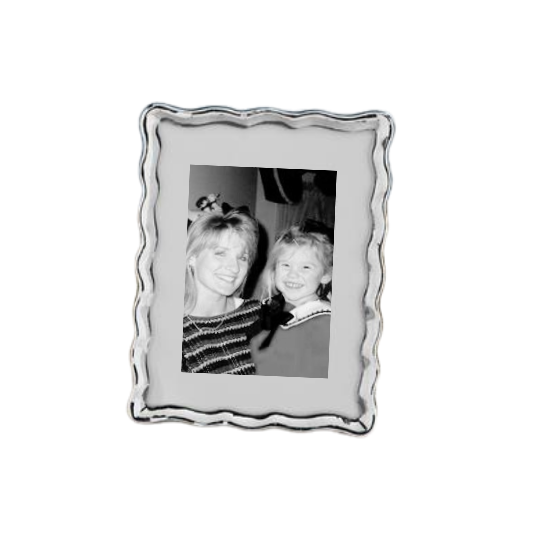 Silver picture frame with a photo of two people inside on a white background