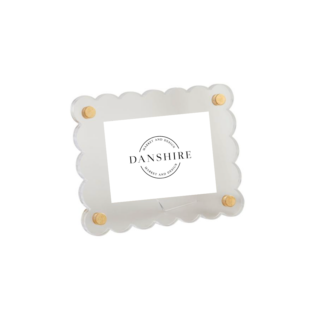 White scalloped photo frame with gold accents on a white background, featuring the Danshire logo.