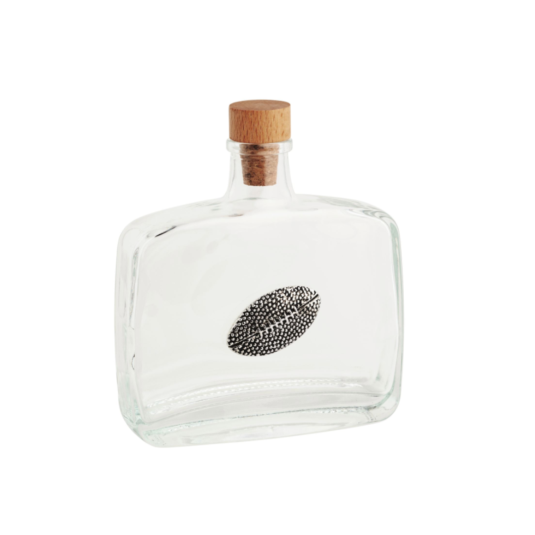 Clear glass bottle with a wooden cork lid on a white background