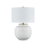Table lamp with a white ceramic base and a white fabric shade on a white background