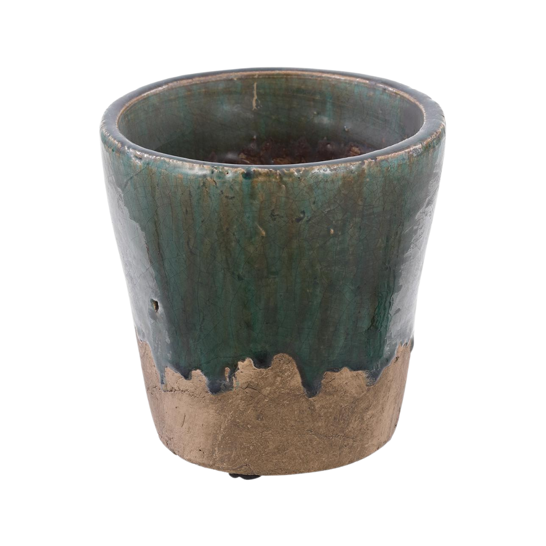 Ceramic pot with green and brown glaze on a white background