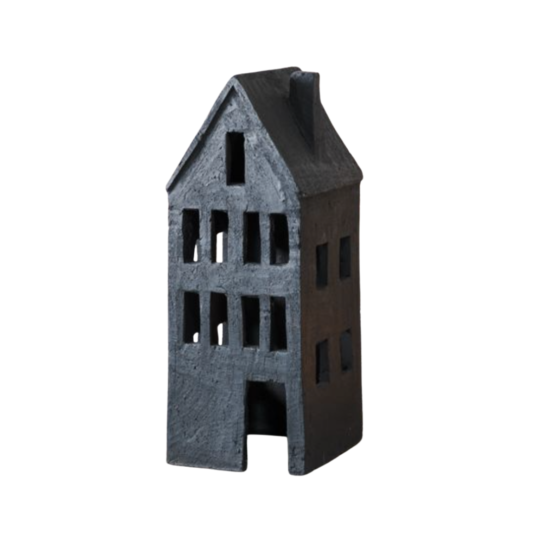 Small model of a house with a grayish-brown color on a white background