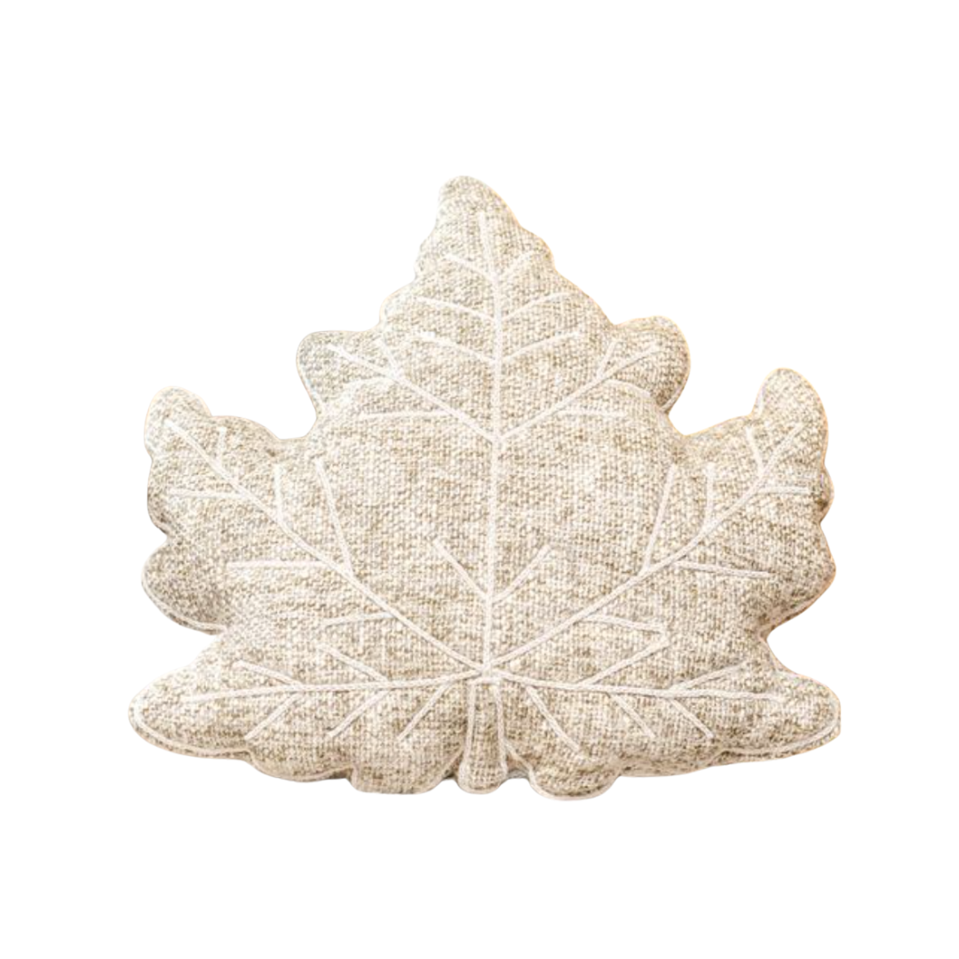 Leaf-shaped pillow on a white background