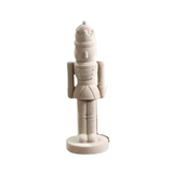 Decorative nutcracker figure on a white background