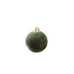 Green Christmas ball ornament on a white background